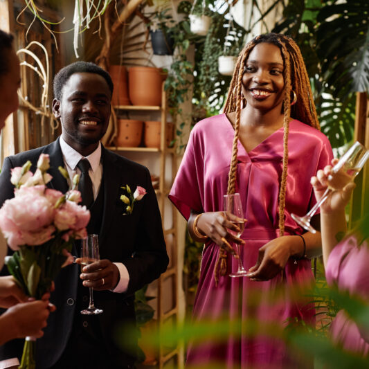 Group of black young people celebrating during wedding reception party